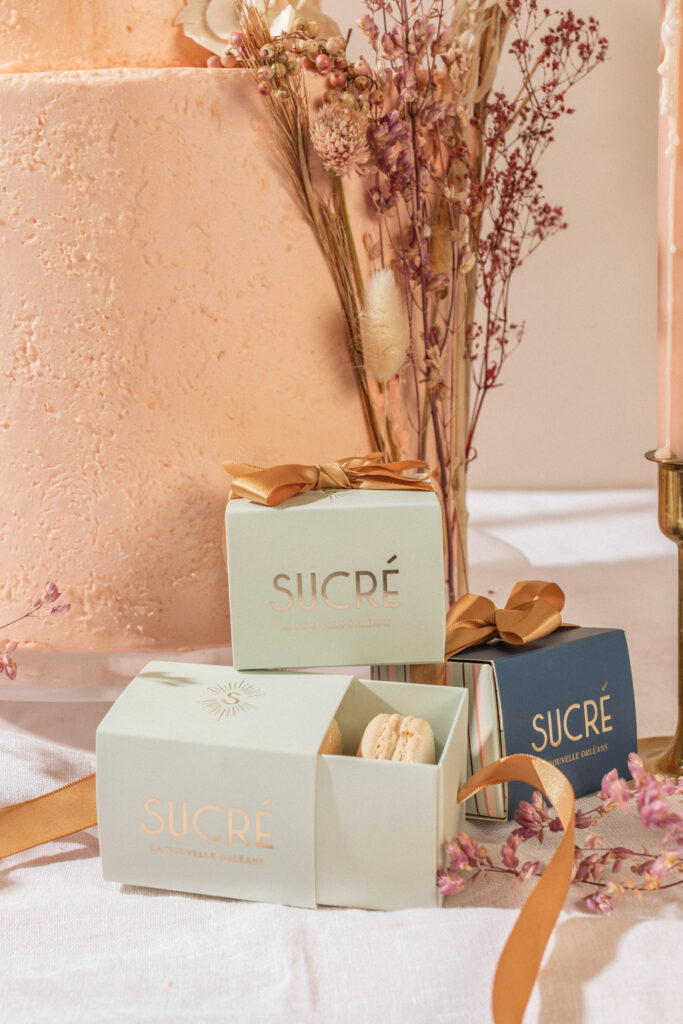Sucre packaged macaroons and dusty pink cake